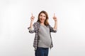 portrait of happy pregnant woman pointing up