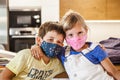 Portrait of Happy Preschool Kids with protective masks Hugging Royalty Free Stock Photo