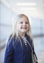 Portrait of happy preschool little girl wearing blue jacket