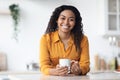 Portrait of happy pretty black woman enjoying morning coffee Royalty Free Stock Photo