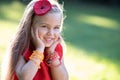 Portrait of happy pretty child girl smiling outdoors enjoying warm sunny summer day Royalty Free Stock Photo