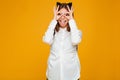 Portrait of a happy pretty schoolgirl with backpack showing ok Royalty Free Stock Photo