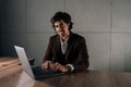 Portrait of happy professional business man company executive ceo manager wearing suit sitting at desk in office working Royalty Free Stock Photo