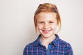 Portrait of happy redhead little girl smiling. Royalty Free Stock Photo