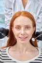 Portrait of Happy redhead woman is being examined by dentist at dental clinic. Royalty Free Stock Photo