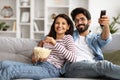 Portrait of happy relaxed indian couple enjoying evening at home Royalty Free Stock Photo