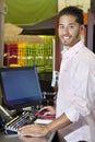 Portrait of a happy salesperson in store