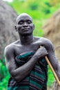 Portrait of Happy and Satisfied African Man with Traditional dress in the local Mursi tribe village