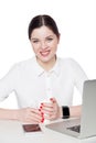 Portrait of happy satisfied attractive brunette businesswoman in white shirt sitting, holding cup of drink and looking at camera