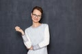 Portrait of happy satisfied young woman standing in relaxed position Royalty Free Stock Photo