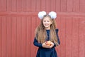 Portrait of a happy school girl standing with red apple on head. Farewell Bell. day of knowledge Royalty Free Stock Photo
