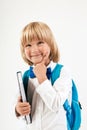 Portrait of happy schoolboy with books and apple isolated on white background. Education, isolated. Royalty Free Stock Photo