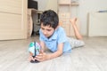 Portrait of a happy schoolboy studying a globe in the room Royalty Free Stock Photo