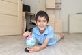 Portrait of a happy schoolboy studying a globe in the room Royalty Free Stock Photo