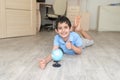 Portrait of a happy schoolboy studying a globe in the room Royalty Free Stock Photo