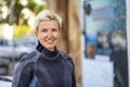 Portrait of a happy scuba diver woman in a wet suit