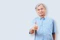 Portrait of happy senior asian man gesture hand showing thumb up or good sign and looking at camera Royalty Free Stock Photo