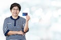 Portrait of happy senior asian woman hold credit card and showing on hand Royalty Free Stock Photo