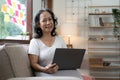 Portrait of happy senior asian woman looking at camera at home. Successful old lady working at home. Beautiful stylish Royalty Free Stock Photo