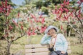 Portrait of happy senior beautiful woman in spring park