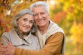 Portrait of happy senior couple in autumn park Royalty Free Stock Photo