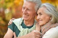 Portrait of happy senior couple in autumn park Royalty Free Stock Photo