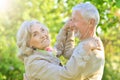 Portrait of happy senior couple dancing in park Royalty Free Stock Photo