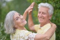 Portrait of happy senior couple dancing in park Royalty Free Stock Photo