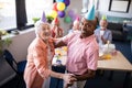 Portrait of happy senior couple dancing at party Royalty Free Stock Photo