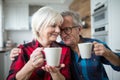 Happy senior couple having morning coffee together Royalty Free Stock Photo