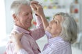 Portrait of happy senior couple at home dancing Royalty Free Stock Photo