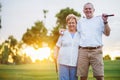 Portrait of happy senior couple playing golf enjoying retirement Royalty Free Stock Photo