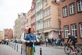 Portrait of happy senior couple tourists riding scooter together outdoors in town Royalty Free Stock Photo