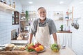 Portrait of happy senior elderly asian grandfather standing cooking meal in kitchen,Old men prepare dinner in hobby lifestyle
