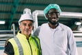 Portrait happy senior engineer with hygiene black african male worker standing together friendly in food factory industry Royalty Free Stock Photo
