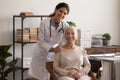 Portrait of happy senior lady visiting doctor, looking at camera Royalty Free Stock Photo