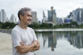 Portrait happy senior man in sportswear relaxing after workout in the city park Royalty Free Stock Photo