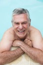 Portrait of happy senior man swimming in pool Royalty Free Stock Photo