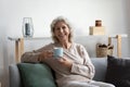 Portrait of happy senior 60s woman holding cup Royalty Free Stock Photo