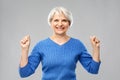 Portrait of happy senior woman celebrating success Royalty Free Stock Photo