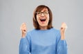 Portrait of happy senior woman celebrating triumph Royalty Free Stock Photo