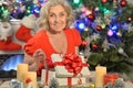 Portrait of happy senior woman with Christmas present Royalty Free Stock Photo