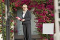 Portrait of a happy senior woman standing with clipboard Royalty Free Stock Photo