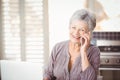 Portrait of happy senior woman talking on mobile phone Royalty Free Stock Photo