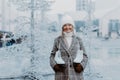 Portrait of happy senior woman in winter at outdoor ice skating rink. Royalty Free Stock Photo