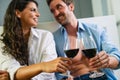 Portrait of happy sexy couple enjoying sensual moments together with food and wine Royalty Free Stock Photo