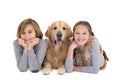 Portrait of happy siblings lying on the floor with their dog Royalty Free Stock Photo