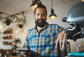 Portrait, happy or small business owner in cafe, restaurant or coffee shop with tablet standing in startup. Smile Royalty Free Stock Photo