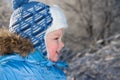 Portrait happy small child the boy on walk in the winter in park Royalty Free Stock Photo