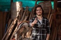 Portrait of happy smile young carpenter caucasian man worker thumbs up with circular saw in factor.